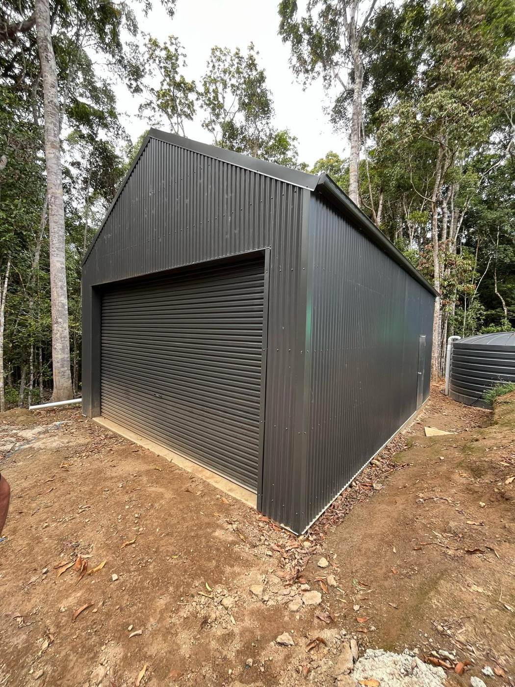 Completed workshop shed with roller door