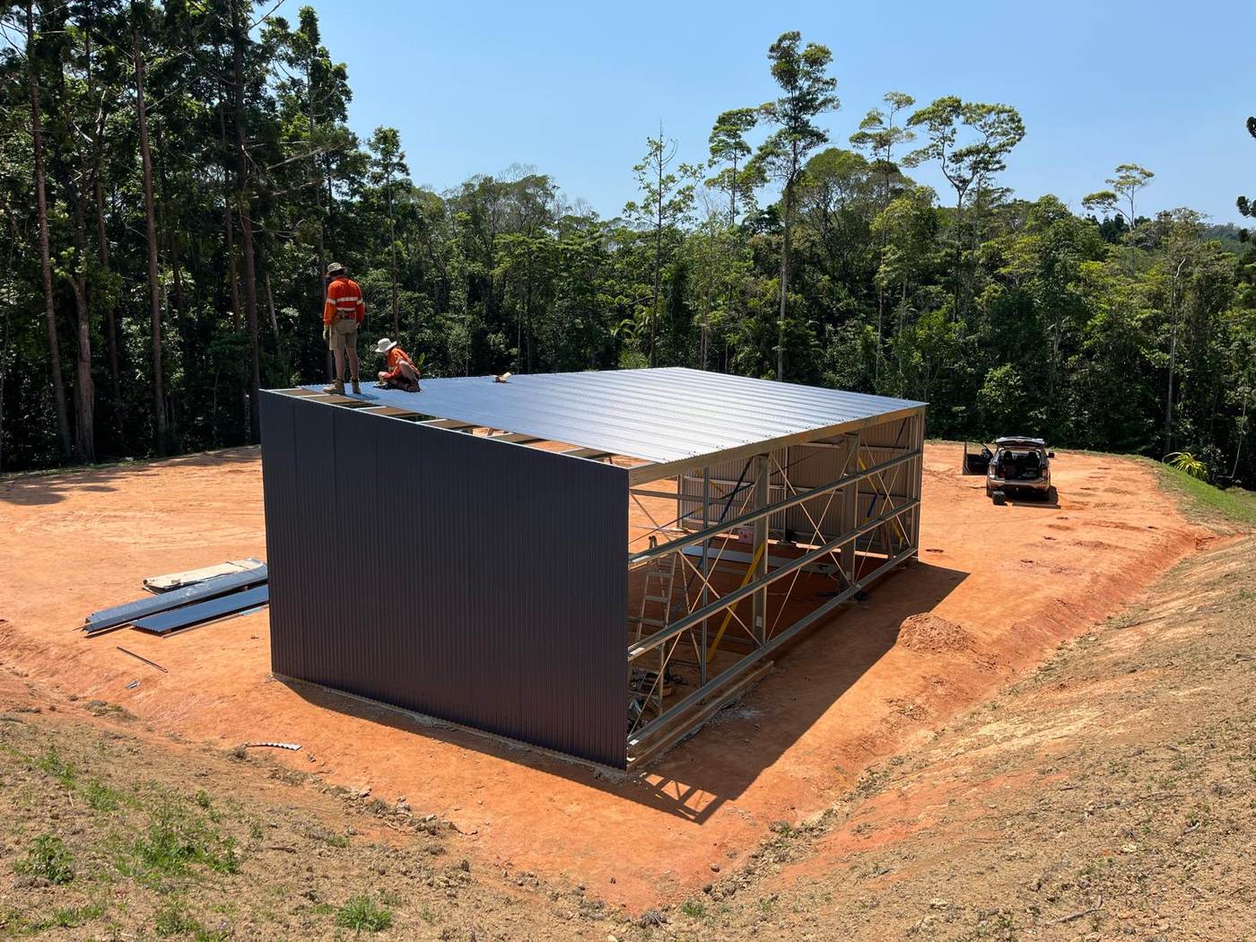 Roof sheeting installed, walls underway